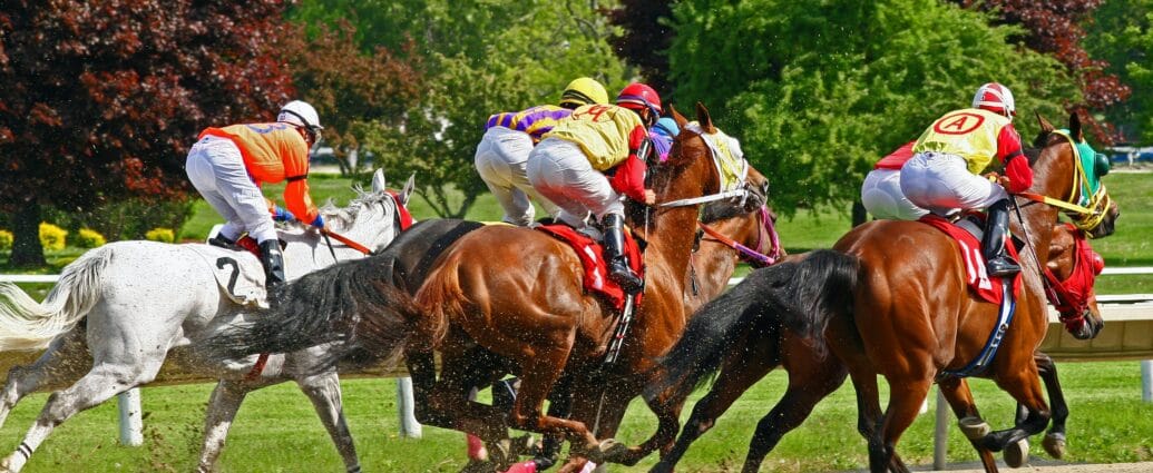 Dynamic horse racing scene with jockeys and vibrant nature backdrop.