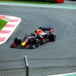 High-speed Formula One car racing at a circuit in Mexico City.