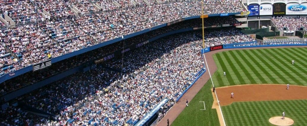 Aerial view of a crowded baseball stadium during a live game.