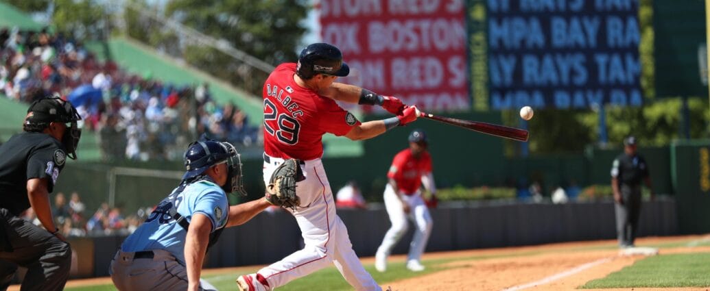 Action-packed baseball game in Santo Domingo, capturing a powerful swing.