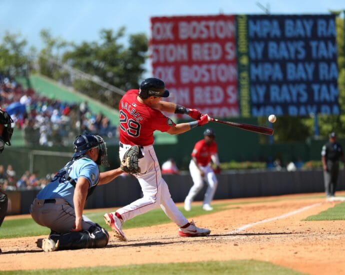 Action-packed baseball game in Santo Domingo, capturing a powerful swing.